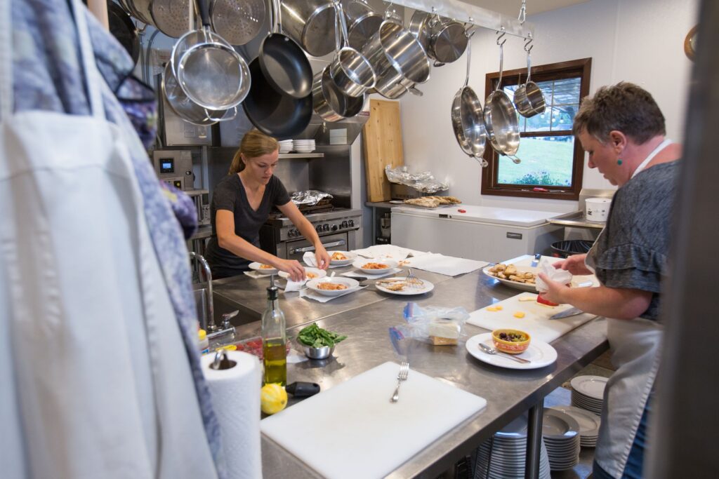 Kitchen staff preparing dinner at Campo di Bella