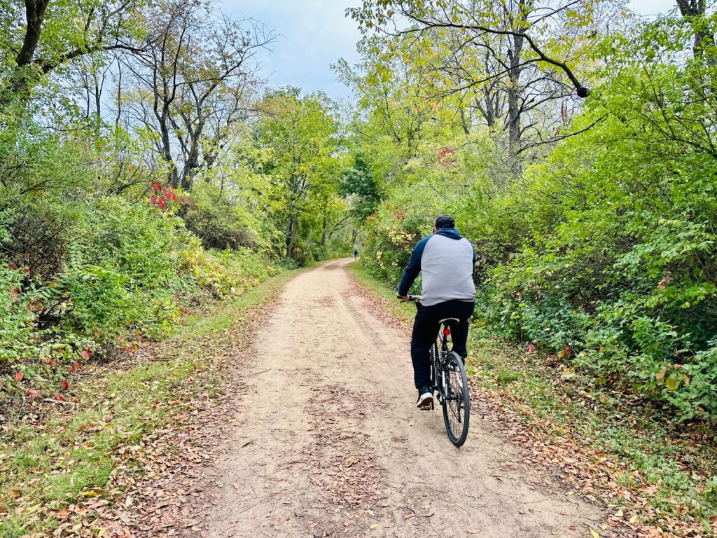 Photo of the Military Ridge State Trail with man biking